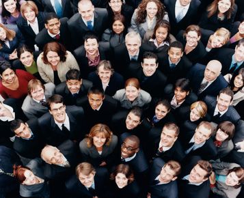 Image of a group of people from above as they are looking up.